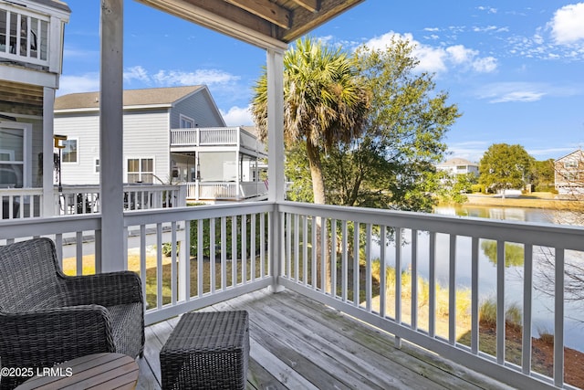 wooden terrace with a water view