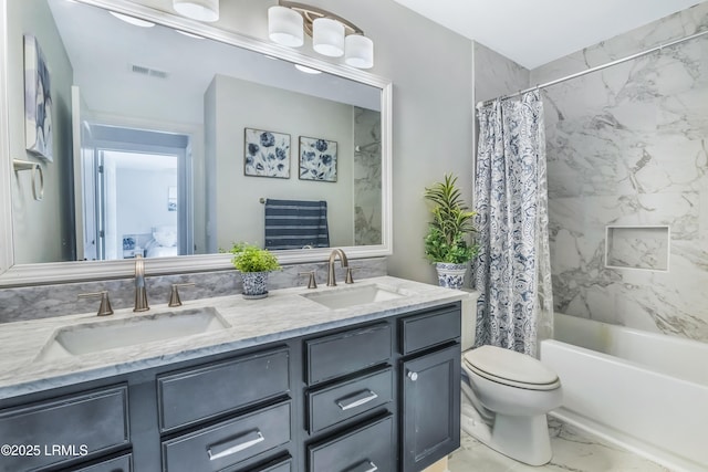 full bathroom with shower / tub combo with curtain, vanity, and toilet