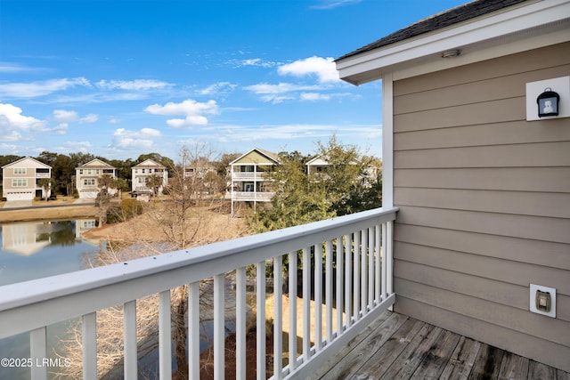 balcony featuring a water view