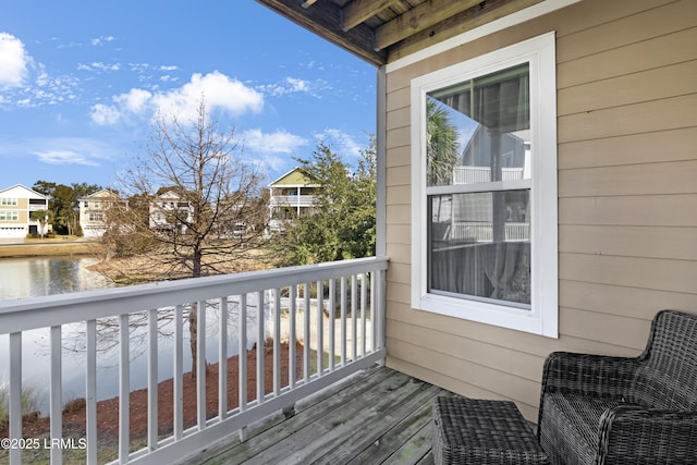 balcony featuring a water view