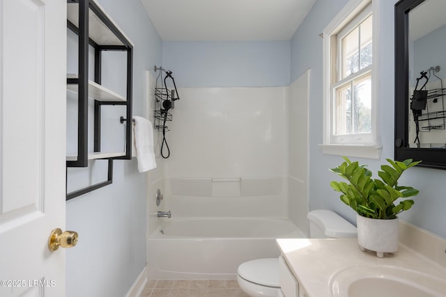 bathroom with tile patterned flooring, tub / shower combination, vanity, and toilet