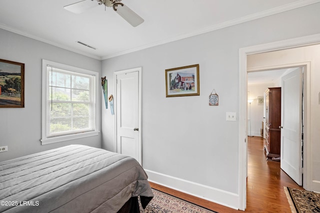 117 Elliott St, Beaufort, SC 29902 - bedroom featuring wood finished floors, crown molding, baseboards, and a ceiling fan