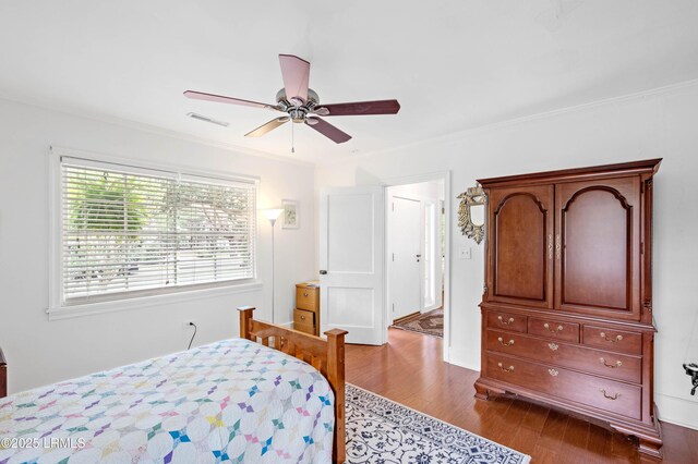 117 Elliott St, Beaufort, SC 29902 - bedroom featuring dark wood finished floors, ceiling fan, and ornamental molding