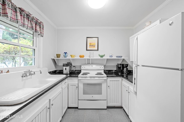 117 Elliott St, Beaufort, SC 29902 - kitchen with white appliances, open shelves, ornamental molding, and dark countertops