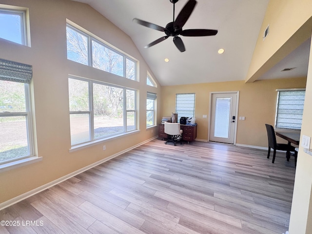 unfurnished office featuring light wood-style flooring, visible vents, and baseboards