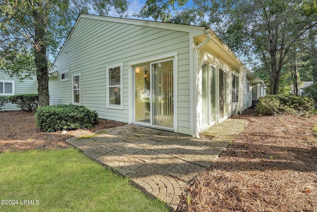 exterior space with a patio and a yard