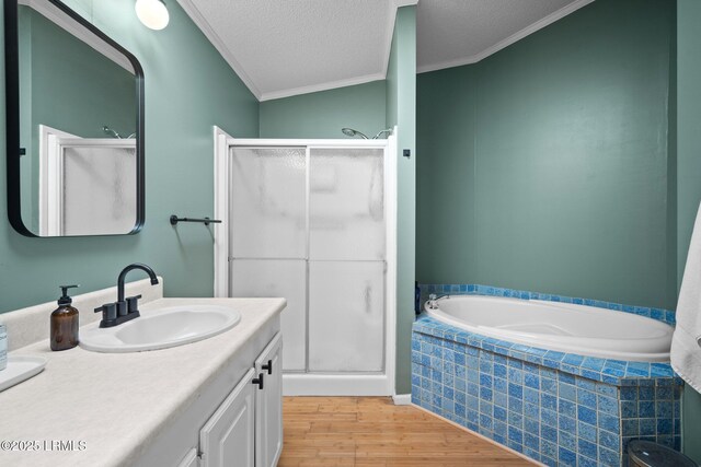 3 Stono Ct, Beaufort, SC 29902 - bathroom featuring a stall shower, wood finished floors, crown molding, a textured ceiling, and vanity