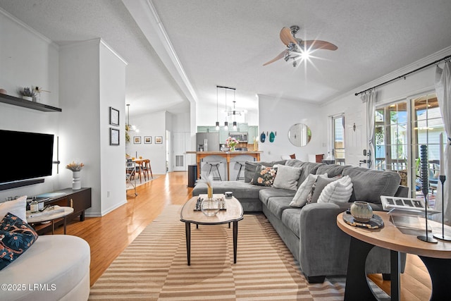3 Stono Ct, Beaufort, SC 29902 - living area with a textured ceiling, ceiling fan, light wood-type flooring, ornamental molding, and a chandelier