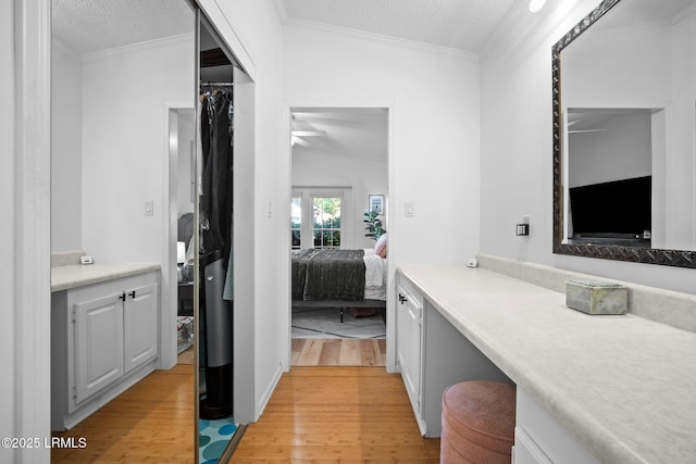 3 Stono Ct, Beaufort, SC 29902 - bathroom featuring ensuite bathroom, wood finished floors, a textured ceiling, ceiling fan, and crown molding