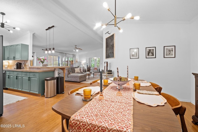 3 Stono Ct, Beaufort, SC 29902 - dining room with a chandelier, lofted ceiling, ornamental molding, light wood-type flooring, and ceiling fan