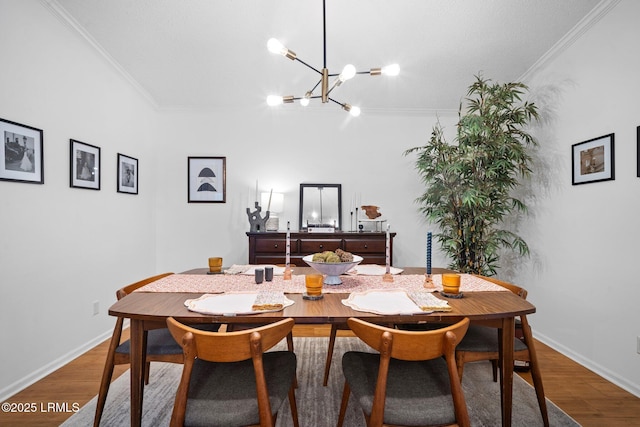 3 Stono Ct, Beaufort, SC 29902 - dining space with ornamental molding, a chandelier, wood finished floors, and baseboards