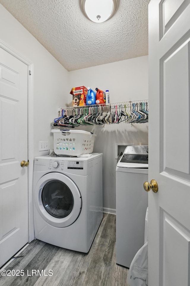 55 Broadland Cir, Bluffton, SC 29910 - laundry area featuring independent washer and dryer, wood finished floors, and a textured ceiling