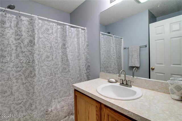 55 Broadland Cir, Bluffton, SC 29910 - bathroom featuring a textured ceiling, vanity, and a shower with curtain