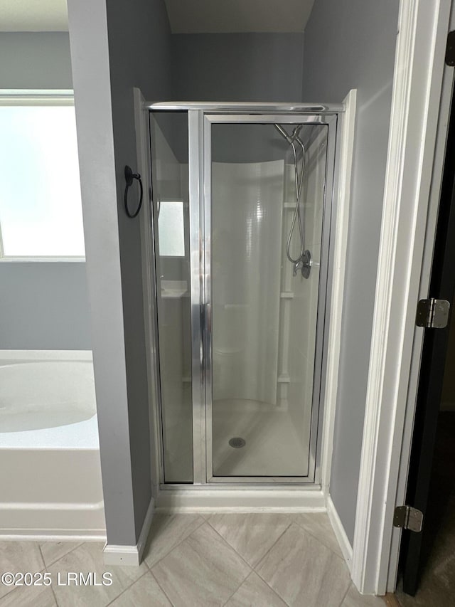 3 Enoree Way, Beaufort, SC 29906 - bathroom featuring a shower stall, baseboards, and a bath