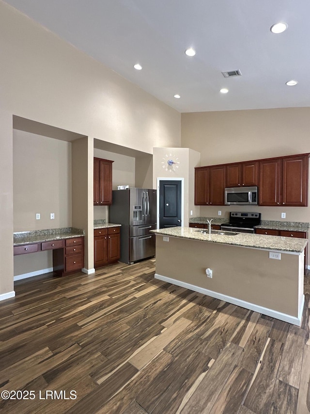3 Enoree Way, Beaufort, SC 29906 - kitchen with appliances with stainless steel finishes, dark wood finished floors, high vaulted ceiling, a sink, and a kitchen island with sink