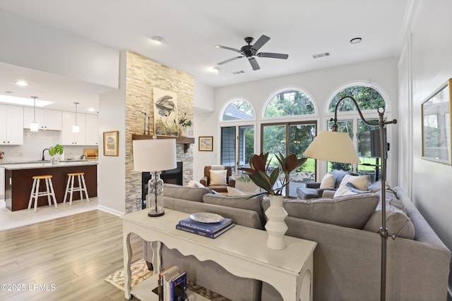 485 Bb Sams Dr, Saint Helena Island, SC 29920 - living room featuring a ceiling fan, light wood-style floors, a stone fireplace, and recessed lighting