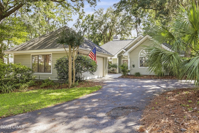 485 Bb Sams Dr, Saint Helena Island, SC 29920 - view of front of home featuring driveway, a garage, and roof with shingles