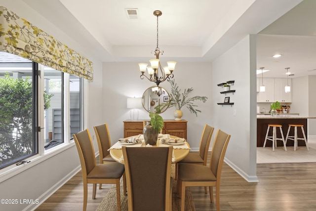 485 Bb Sams Dr, Saint Helena Island, SC 29920 - dining area featuring a chandelier, wood finished floors, a tray ceiling, and recessed lighting