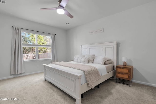 bedroom with light colored carpet and ceiling fan