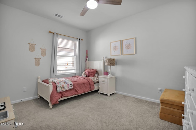 bedroom with light colored carpet and ceiling fan