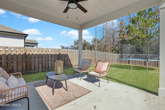 view of patio with a trampoline and ceiling fan