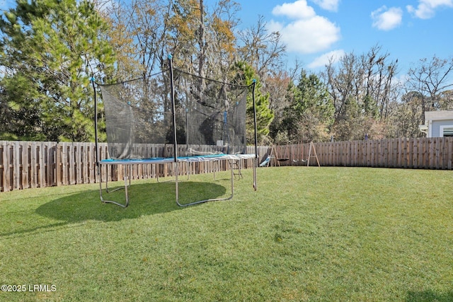 view of yard featuring a trampoline