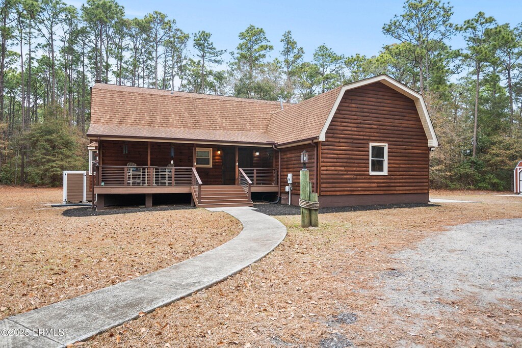 31 Faculty Dr, Beaufort, SC 29907 - log home featuring covered porch