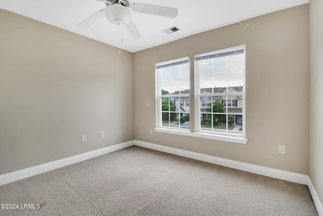 spare room with ceiling fan and carpet flooring