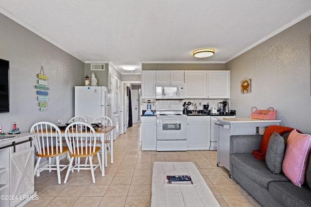 kitchen with white cabinetry, white appliances, ornamental molding, and light tile patterned flooring