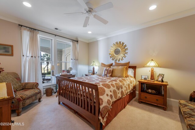 carpeted bedroom featuring crown molding and ceiling fan