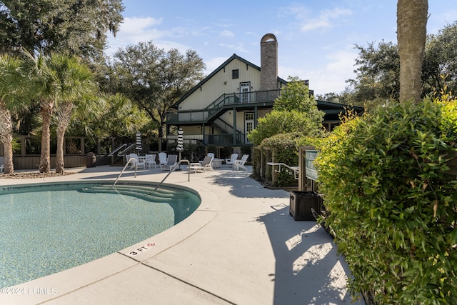 view of pool featuring a patio area