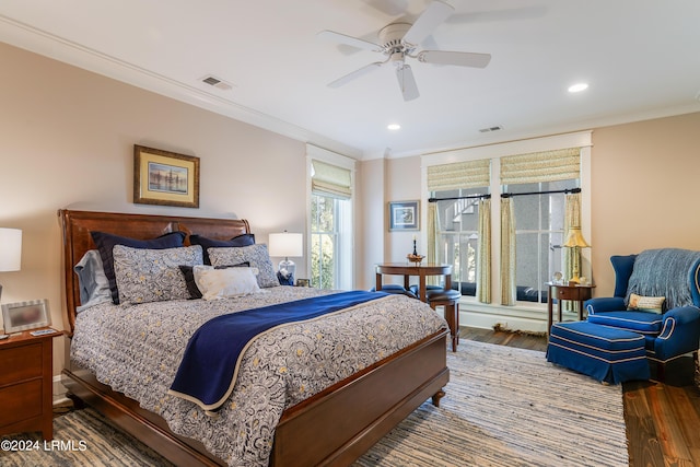 bedroom featuring crown molding, ceiling fan, and hardwood / wood-style floors