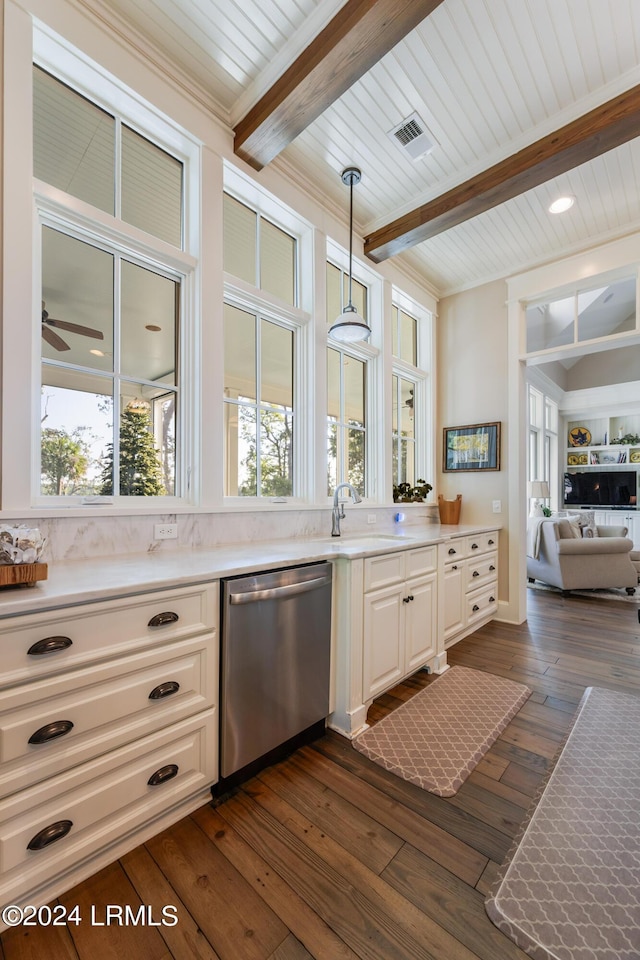 kitchen featuring sink, dark wood-type flooring, dishwasher, beam ceiling, and decorative light fixtures