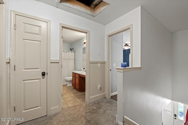 20 Pennyroyal Way, Beaufort, SC 29906 - hallway featuring light carpet, a wainscoted wall, and light tile patterned flooring