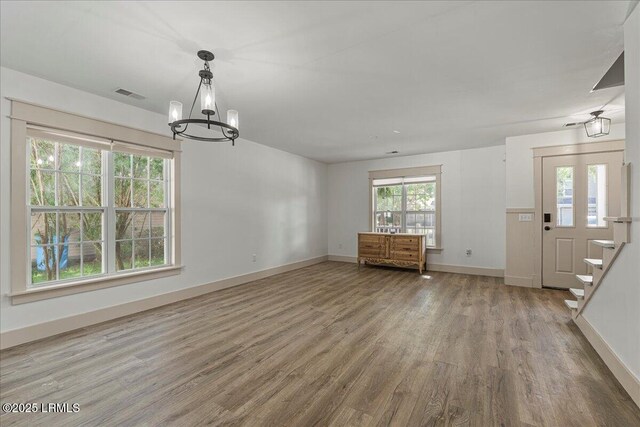 20 Pennyroyal Way, Beaufort, SC 29906 - unfurnished living room with a chandelier, wood finished floors, and stairs
