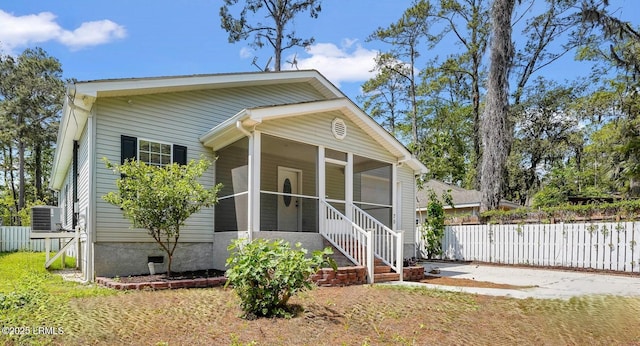 47 River Tree Cir, Bluffton, SC 29910 - bungalow featuring a sunroom, fence, and cooling unit