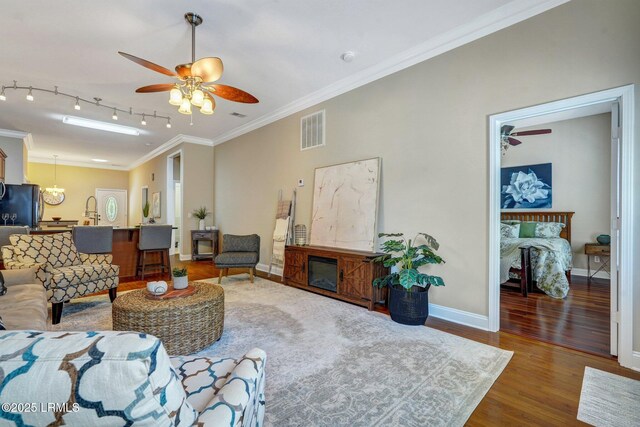 47 River Tree Cir, Bluffton, SC 29910 - living area featuring wood finished floors, visible vents, baseboards, and ceiling fan with notable chandelier