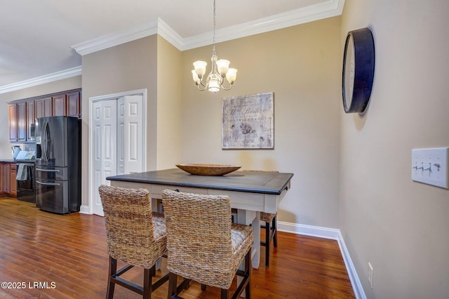 47 River Tree Cir, Bluffton, SC 29910 - dining room featuring dark wood-type flooring, a chandelier, crown molding, and baseboards