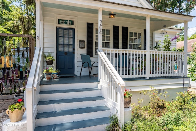 entrance to property featuring a porch