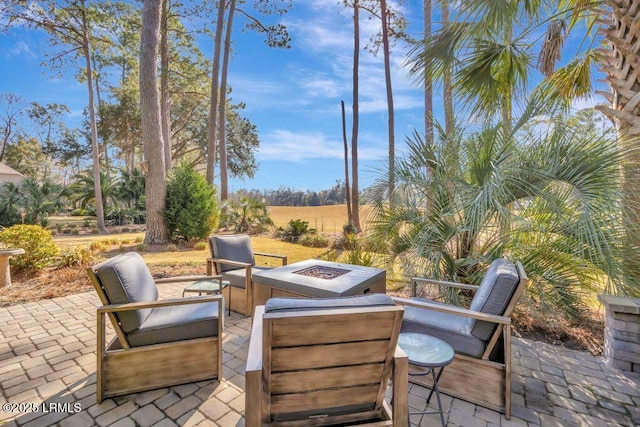 view of patio / terrace featuring a fire pit