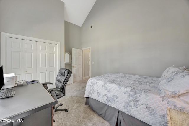 bedroom with light carpet, high vaulted ceiling, and a closet