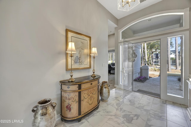 foyer featuring a notable chandelier