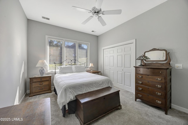 bedroom with light carpet, a closet, and ceiling fan