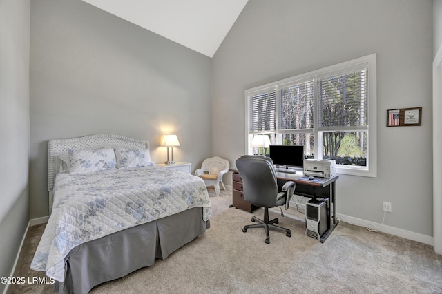 carpeted bedroom featuring high vaulted ceiling