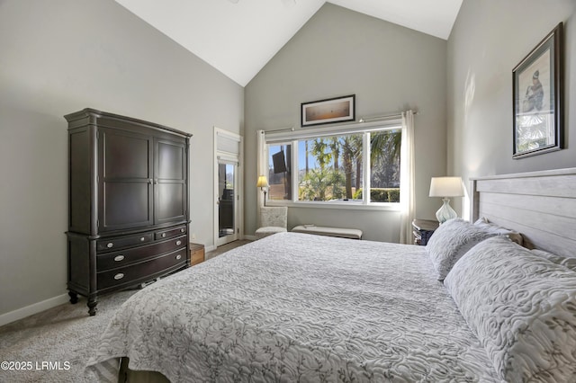 bedroom with light carpet and high vaulted ceiling