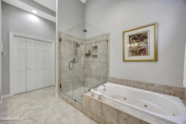 bathroom featuring tile patterned flooring and independent shower and bath