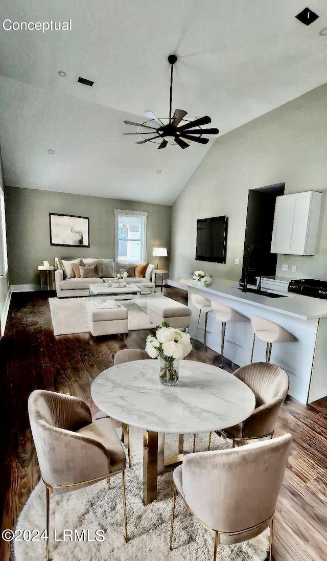 dining room featuring lofted ceiling, sink, light hardwood / wood-style flooring, and ceiling fan