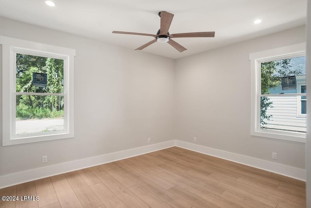 empty room featuring ceiling fan and light wood-type flooring