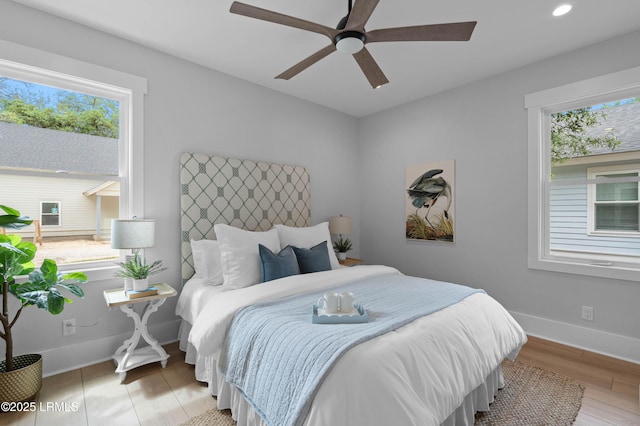 bedroom with recessed lighting, baseboards, ceiling fan, and light wood-type flooring