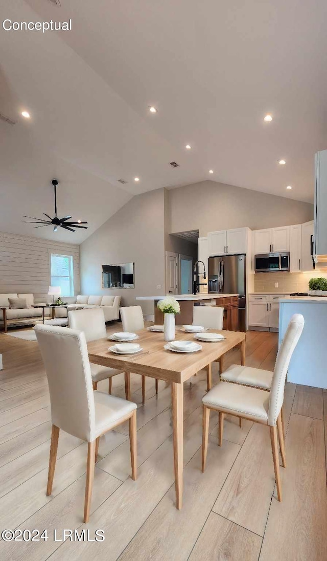 dining room with sink, vaulted ceiling, ceiling fan, and light wood-type flooring